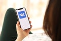 KYIV, UKRAINE - APRIL 1, 2024 Vkontakte icon on smartphone screen in young female hands