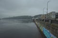 Wide-angle landscape view of pathway under the water along the Dnieper River embankment.