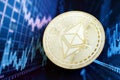 KYIV, UKRAINE - AUGUST 17, 2024 Ethereum ETH coin on abstract fictional cryptocurrency trading chart in blue color