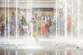 KYIV, UKRAINE AUGUST 13, 2017: Happy kids have fun playing in city water fountain on hot summer day. Royalty Free Stock Photo
