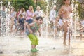 KYIV, UKRAINE AUGUST 13, 2017: Happy kids have fun playing in city water fountain on hot summer day. Royalty Free Stock Photo