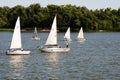 Group of yachts sail under sail along the Dnipro river at the end of Military parade Royalty Free Stock Photo