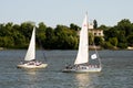 Two yachts sails under sail along the Dnipro river at the end of Military parade Royalty Free Stock Photo