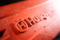 Kyiv, Ukraine - August 17, 2022: Protective tire cover of an old orange chainsaw with the logo of the Husqvarna company close-up
