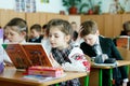 Kyiv/Ukraine - 02 18 2019: Classroom with pupils in school clothes with young attractive teacher in ukrainian school. School life,