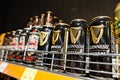 Kyiv, Ukraine - December 19, 2018: Cans of Guinness beer on supermarket stand shelves. Guinness is an Irish dry stout that