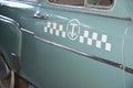 Close up on USSR 1950s taxi car with taxi sign. Taxi cab concept