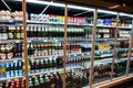 Kyiv, Ukraine - December 19, 2018: Different beer bottles on shelves of fridge in a supermarket