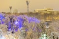 Evening Kiev landscape. Snow-covered trees and the Cabinet of Ministers building. Kyiv, Ukraine