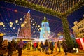 Evening on Sophia Square with a view on decorative gate of the Christmas Fair with tall and richly decorated main Christmas Tree