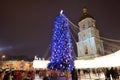 The group of people and the Bell Tower of Saint Sofias Cathedral and New Year Tree