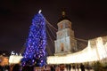 The group of people and the Bell Tower of Saint Sofias Cathedral and New Year Tree