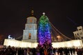 The group of people and the Bell Tower of Saint Sofias Cathedral and New Year Tree