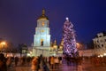 The group of people and the Bell Tower of Saint Sofias Cathedral and New Year Tree