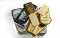 A pile of gold and silver bars from different manufacturers lies on a white background Royalty Free Stock Photo