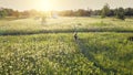 Kyiv, Ukraine, Europe. Traveler girl ride bicycle aerial. Sun field. Nature landscape Royalty Free Stock Photo