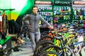 Kyiv, Ukraine, February 28, 2020: bike Expo 2020, the seller stands near the bikes showing them to customers