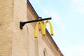 A sign of the American fast food restaurant chain McDonald\'s on the wall Royalty Free Stock Photo