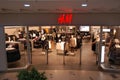 Kyiv, Ukraine. H&M store of international chain of mass fashion retail clothing stores brand logo in a large shopping