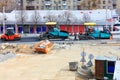 Kyiv, Ukraine, 03/28/2020. Large pavers and a road vibratory roller go one after another on the construction of a new traffic