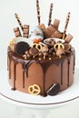 KYIV, UKRAINE - January 15: Birthday cake with brown cream cheese frosting and chocolate drips decorated with Kinder egg toy,