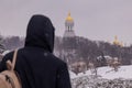 the city is covered in snow, but people still go out for a walk on the day off.