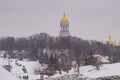 the city is covered in snow, but people still go out for a walk on the day off.