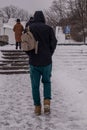 the city is covered in snow, but people still go out for a walk on the day off.