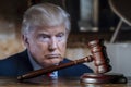 Donald Trump and the court session. The wooden judge gavel on the background of Trump