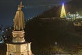 Evening view Christmas decoration of Kyiv. New Year tree with illumination near the New Pedestrian Bridge