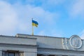 The flag on the top of Verkhovna Rada building parliament house on Hrushevsky street in Mariins