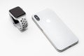 KYIV, UKRAINE - 26 JANUARY, 2018: New Iphone X smartphone model and apple watch close up. Newest Apple devices on white Royalty Free Stock Photo