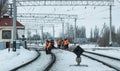 Snow-covered gauge of an old railway in an industrial area in Eastern Europe