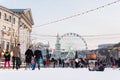 Kyiv, Ukraine - January 2020: people on a skating rink at the Christmas market on Kontraktova Square