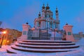 Wide angle view of Saint Andrew`s Church on a hill called Andriyivskyy Descent. Winter morning landscape