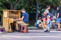 Unidentified musician plays on a piano on Mikhailovskaya Square in the center of Kyiv. Street