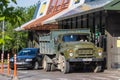 A large heavy truck is standing in a fast food restaurant.