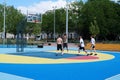 Teenagers plays streetball at new sport zone at expocenter, Kyiv, Ukraine
