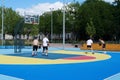 Teenagers plays streetball at new sport zone at expocenter, Kyiv, Ukraine