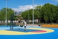 Teenagers plays streetball at new sport zone at expocenter, Kyiv, Ukraine