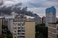 KYIV, UKRAINE - JUN 05, 2022: Kyiv rocked by blasts from Russian cruise missiles. Smoke rises over residents houses after missile