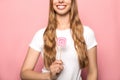 KYIV, UKRAINE - JUNE 7, 2019: cropped view of woman holding Instagram sign isolated on pink