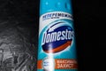 KYIV, UKRAINE - June 20, 2023 :.Domestos blue bottle household cleaning range on black background