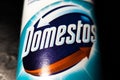 KYIV, UKRAINE - June 20, 2023 :.Domestos blue bottle household cleaning range on black background