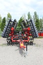 Large disc plough, towing for tractors to plow fields, against the sky at Kyiv, Ukraine