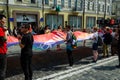 Kyiv, Ukraine - June 23, 2019. March of equality. LGBT march KyivPride. Gay parade. People unfurled a huge rainbow flag