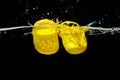 Kyiv, Ukraine - June 6, 2023: Miniature Yellow Crocs Shoes Splash Photography