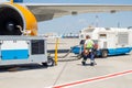 Kyiv, Ukraine - June16th, 2019: Big modern commercial plane parked on airport runway and connected to ground supply