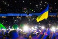 KYIV, UKRAINE - JUNE 21: Ukrainian flag on concert of Okean Elzy on JUNE 21 2014 in NSC Olimpiyskiy. Final concert of world tour