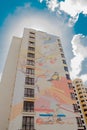 KYIV, UKRAINE - MAR 19, 2019: birds on the branches - part of large-scale legal graffiti on the wall of a multistory building